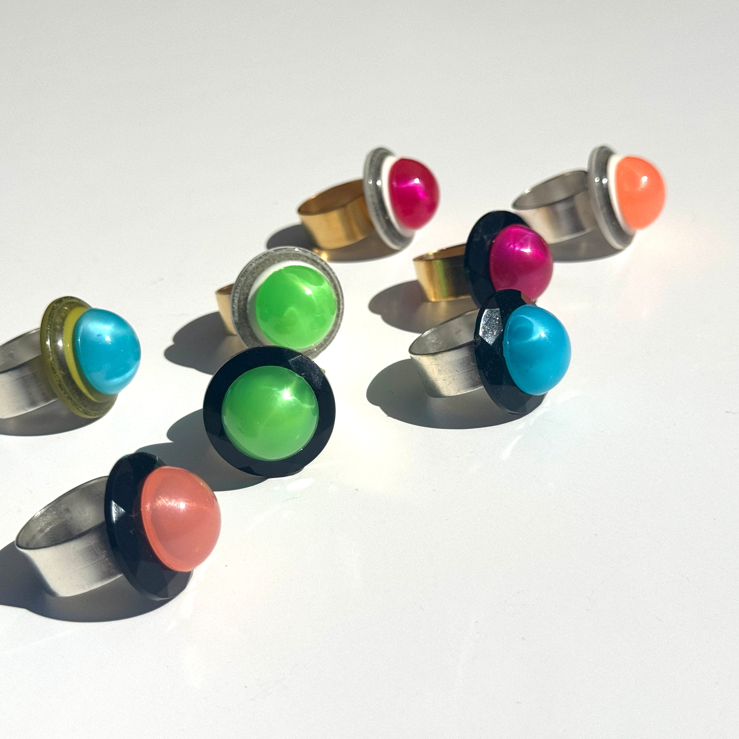 Set of colorful ring earrings on a white background