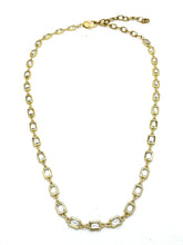 Gold chain necklace on a white background