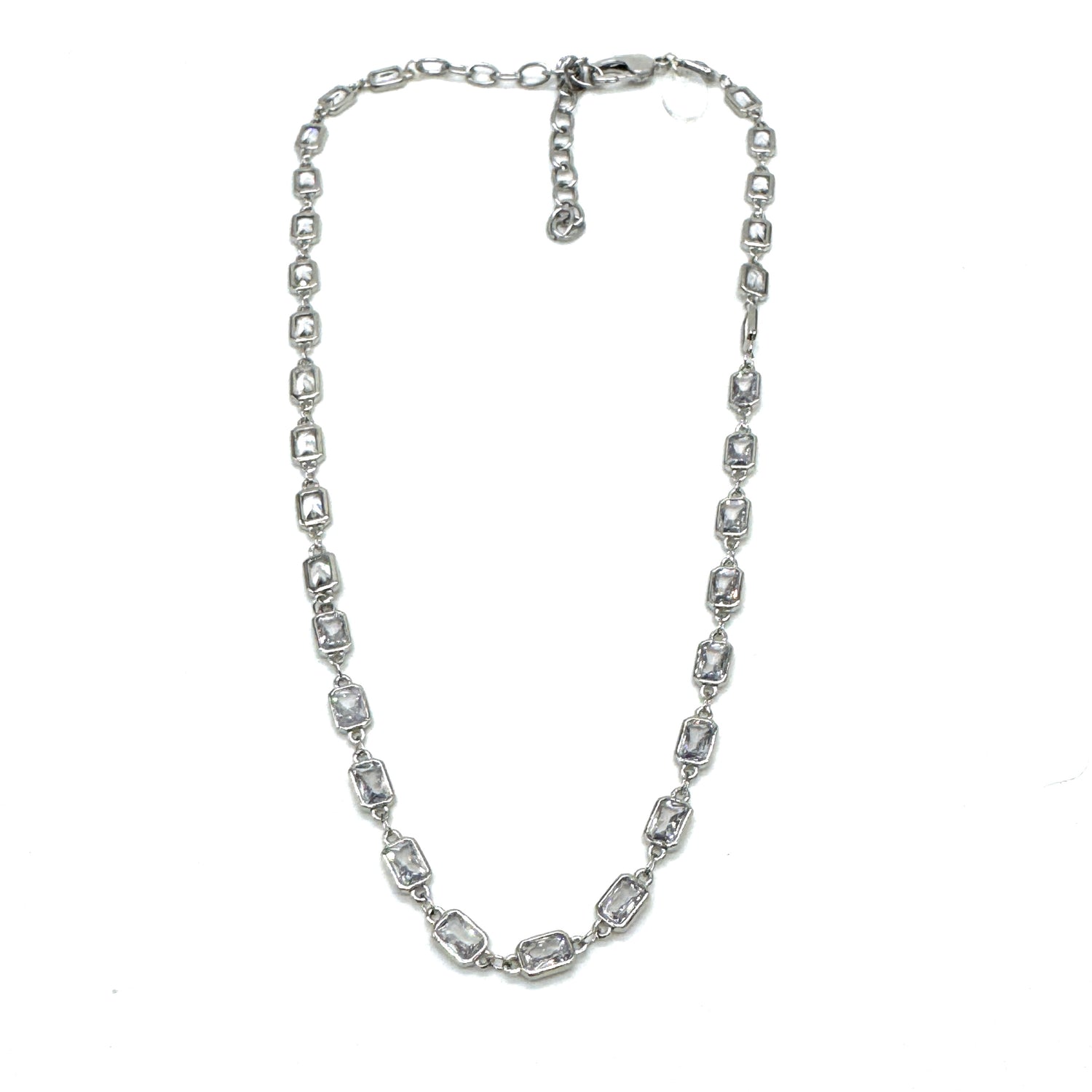 Silver necklace with clear stones on a white background