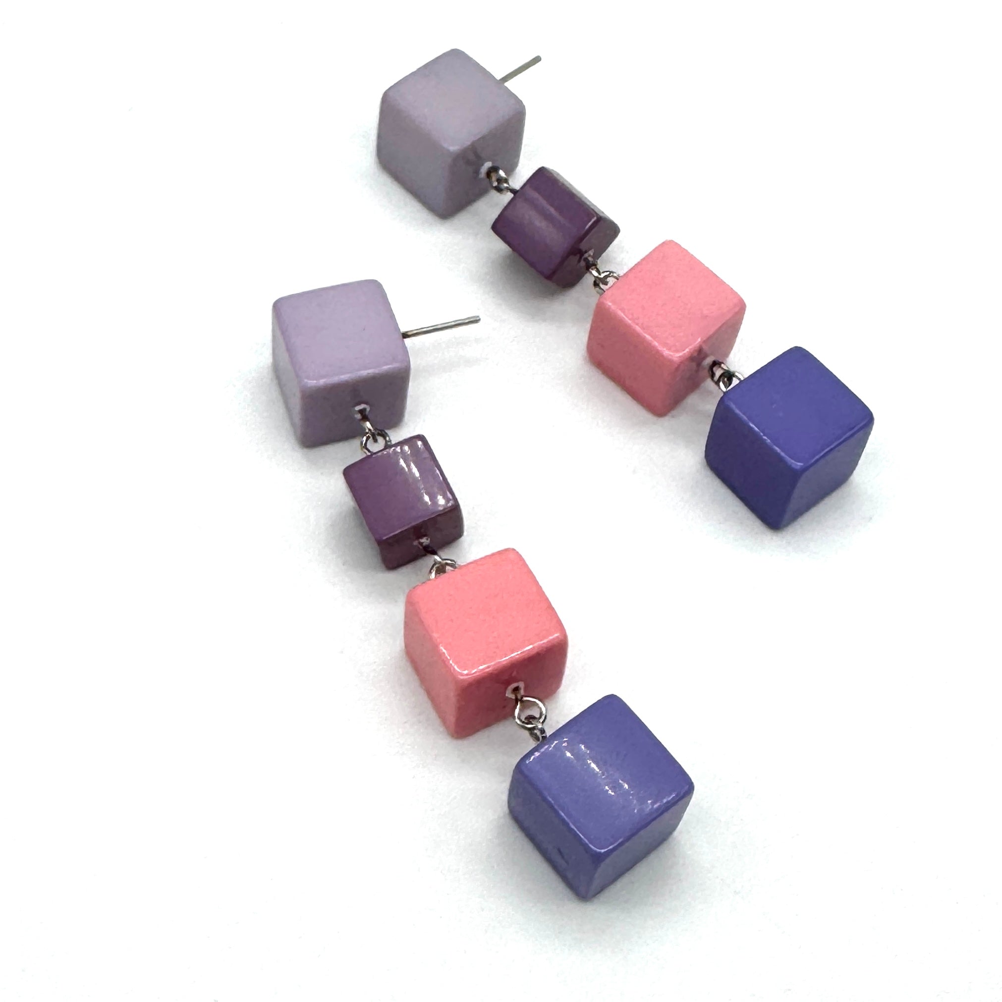 Colorful square bead earrings on a white background