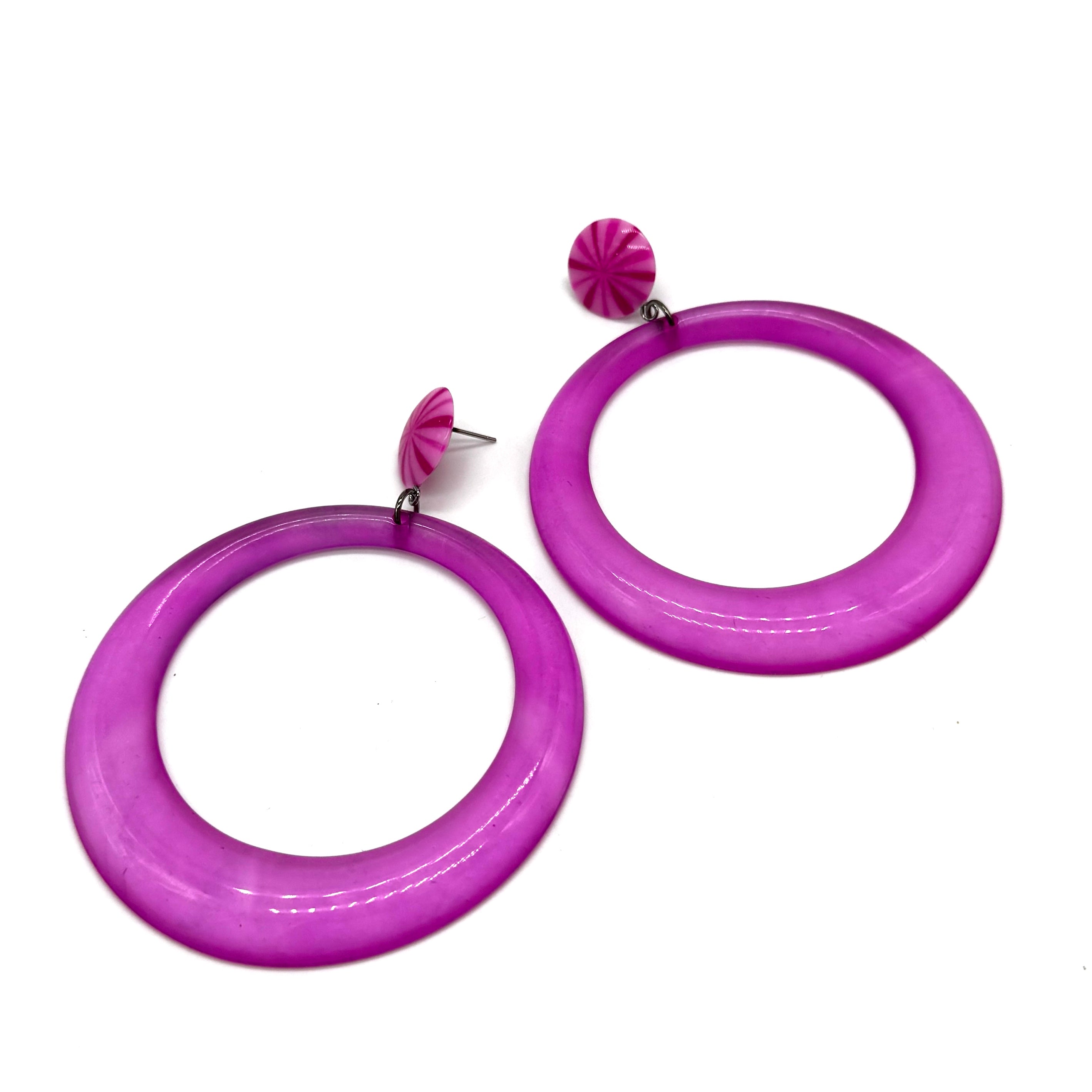 Purple hoop earrings on a white background