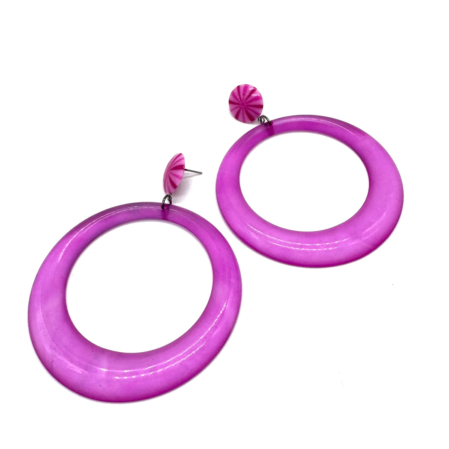 Purple hoop earrings on a white background