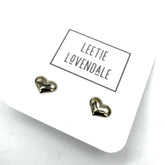 Heart-shaped earrings on a white card with &