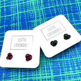 Two pairs of earrings on &