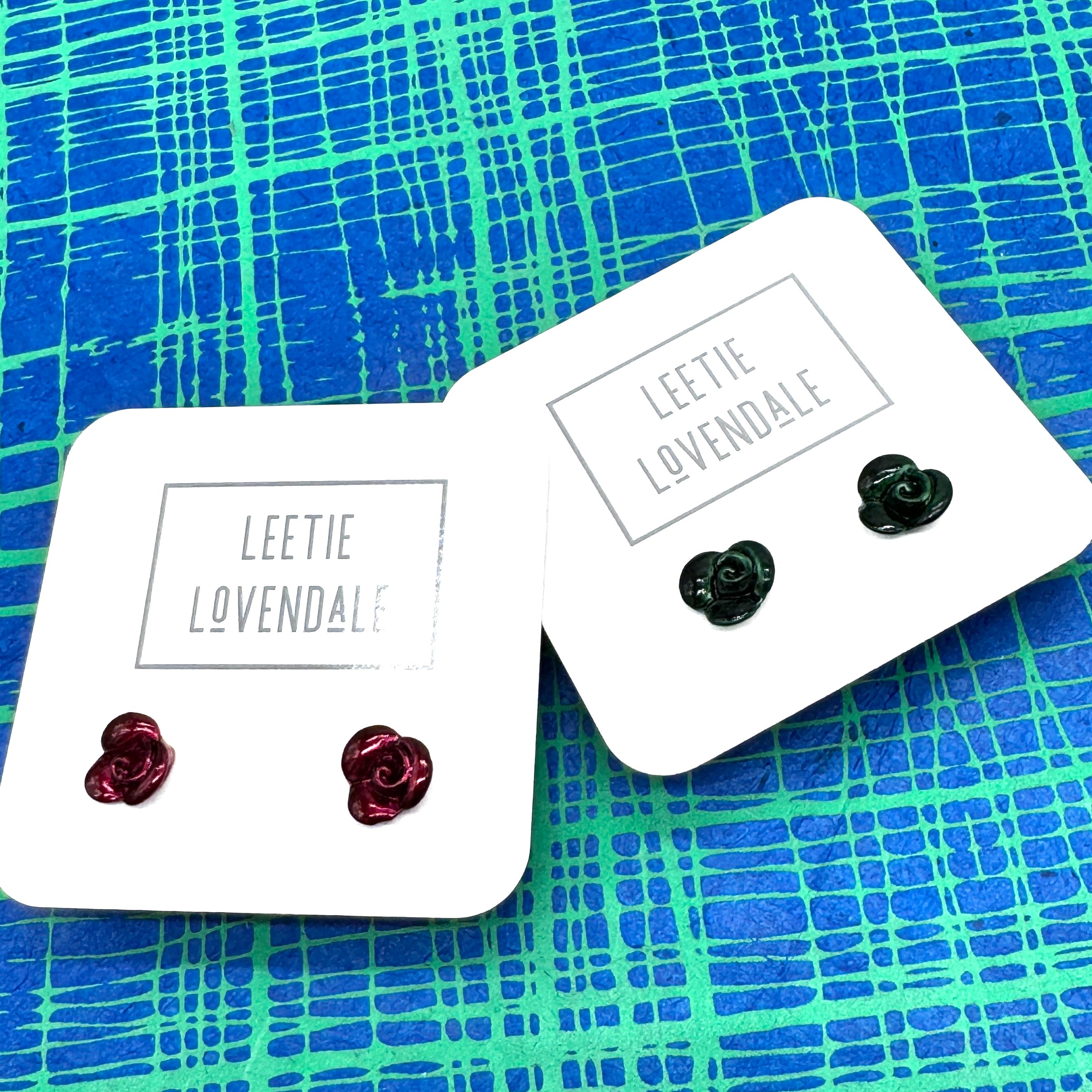 Two pairs of earrings on &