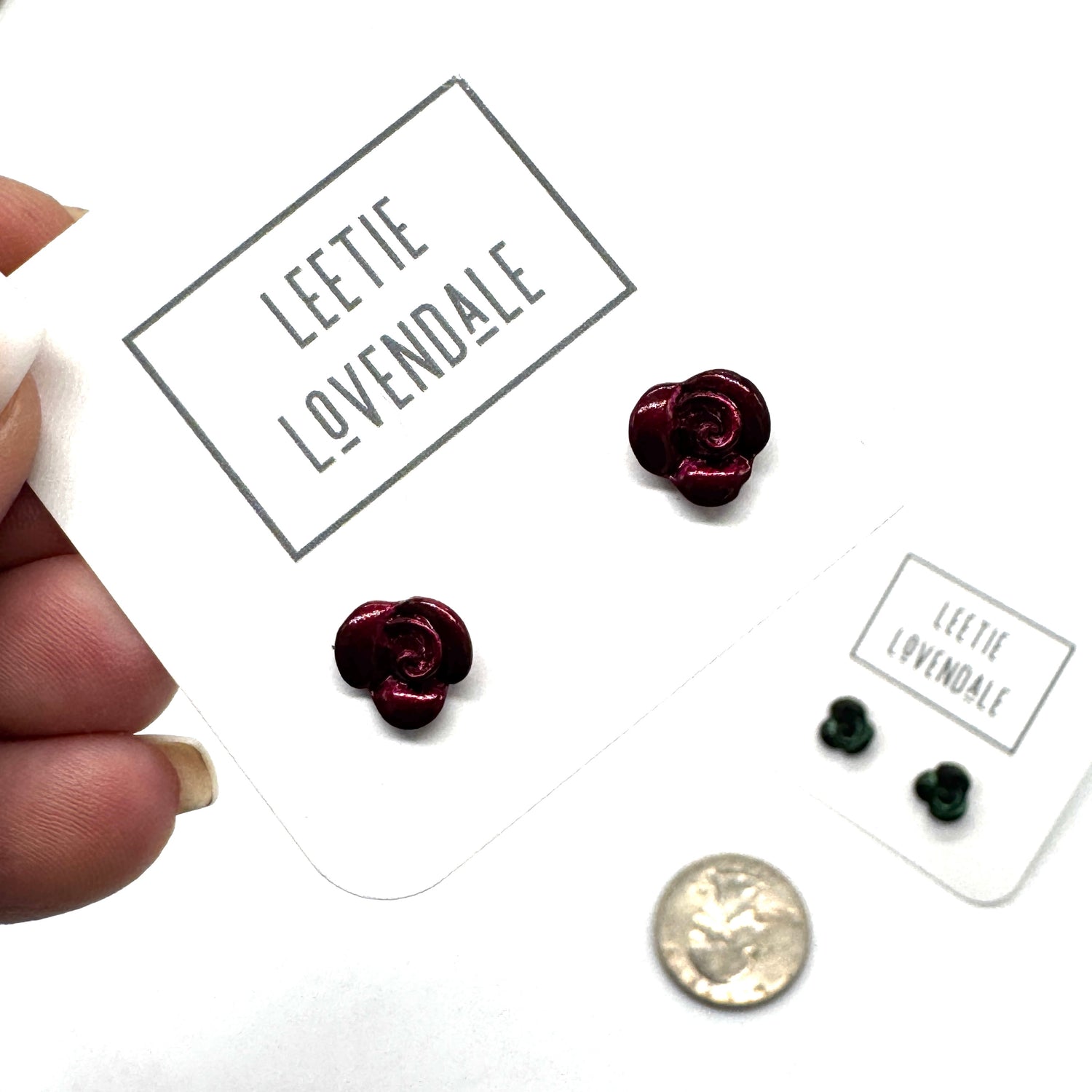 Rose-shaped earrings on a &