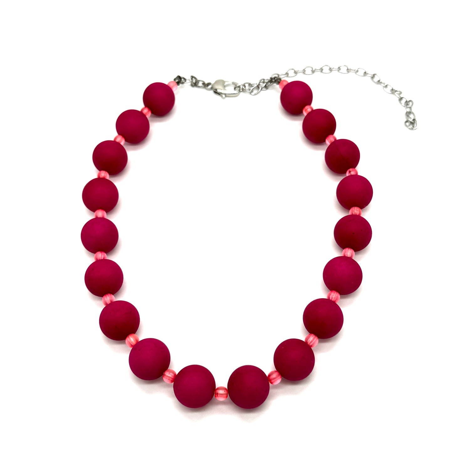 Necklace with red beads on a white background