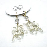 Crystal horse earrings on a white background with &