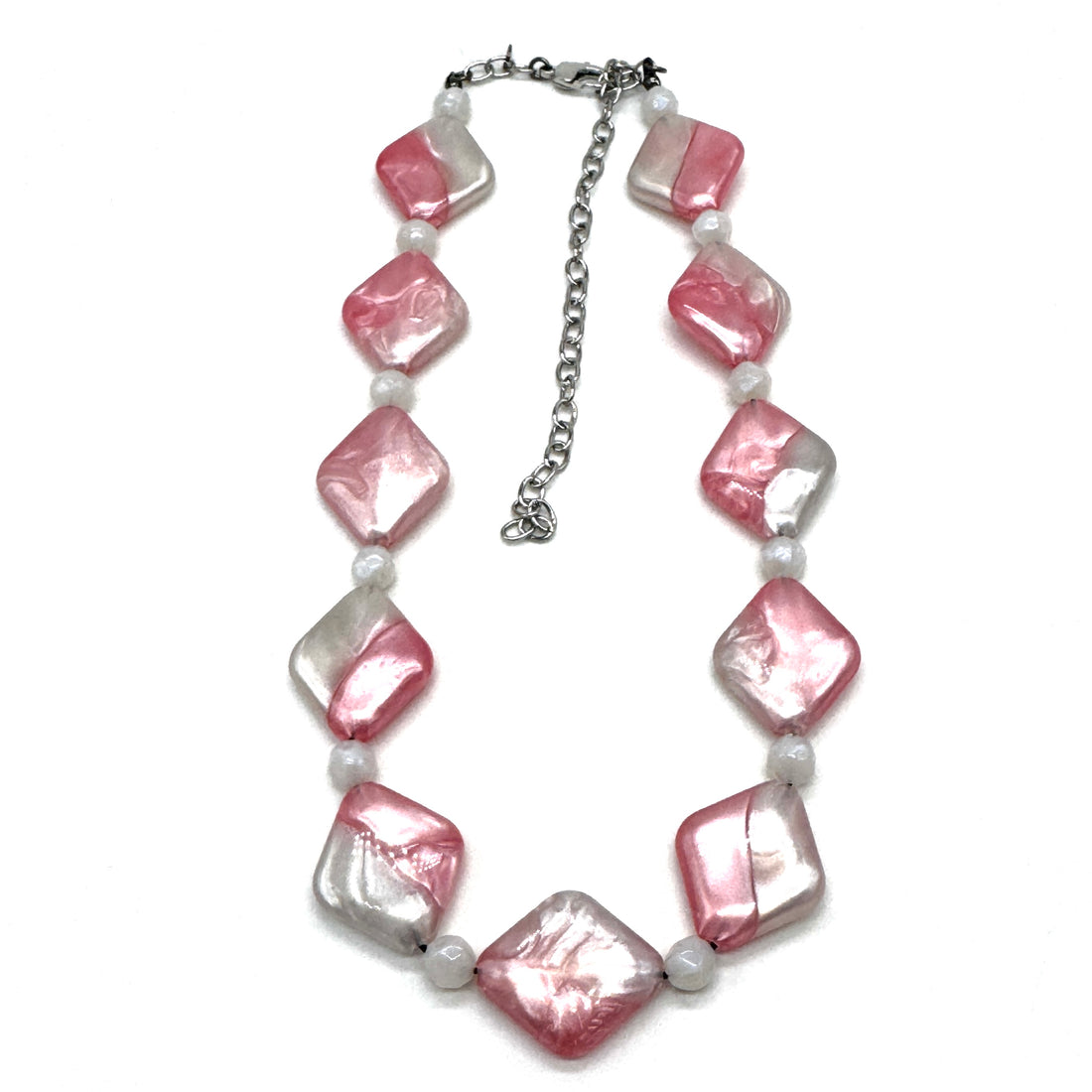 Necklace with pink and white beads on a white background