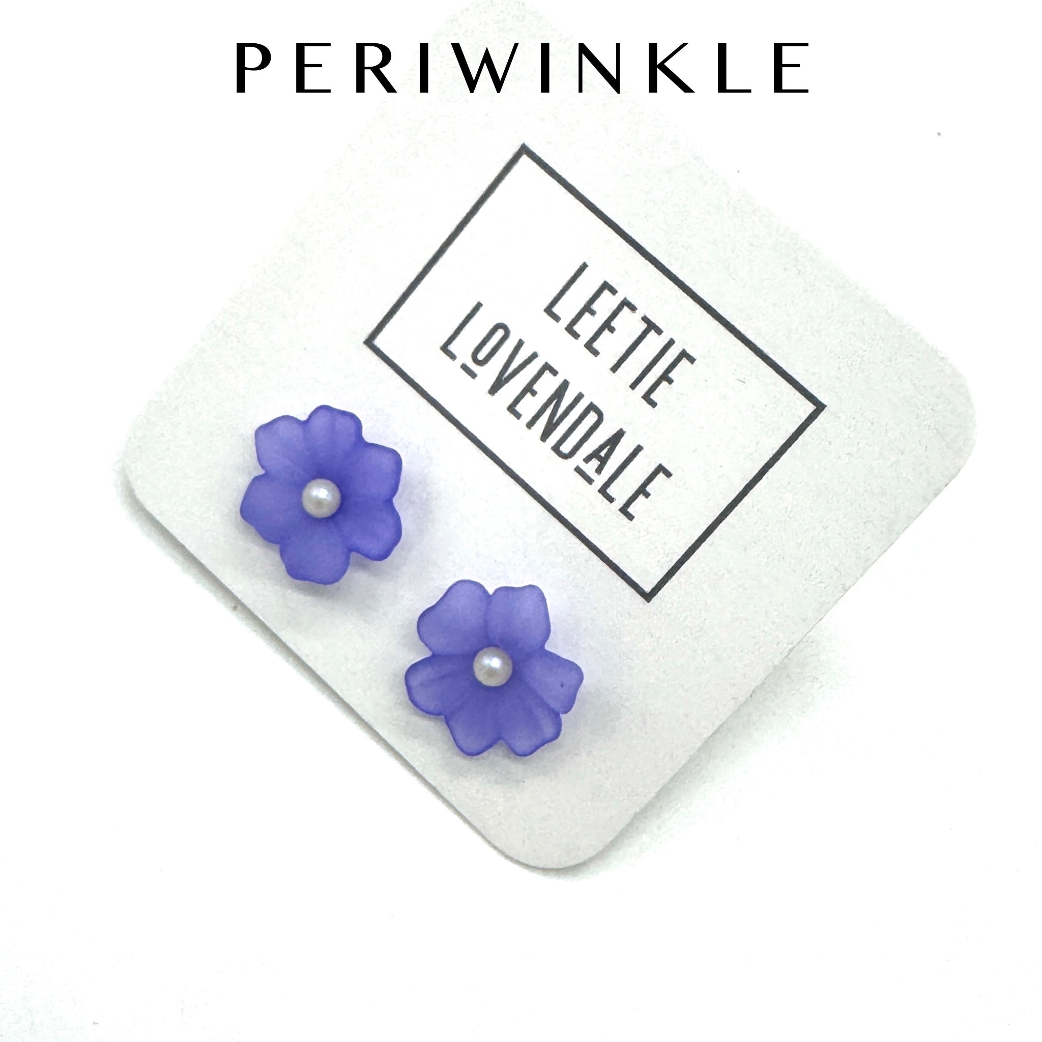 Periwinkle flower stud earrings on a white background