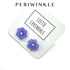Periwinkle flower stud earrings on a white background