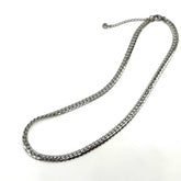 Adjustable silver snake chain necklace on a white background.