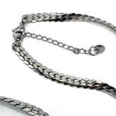 Closeup of clasp on an adjustable silver snake chain necklace.