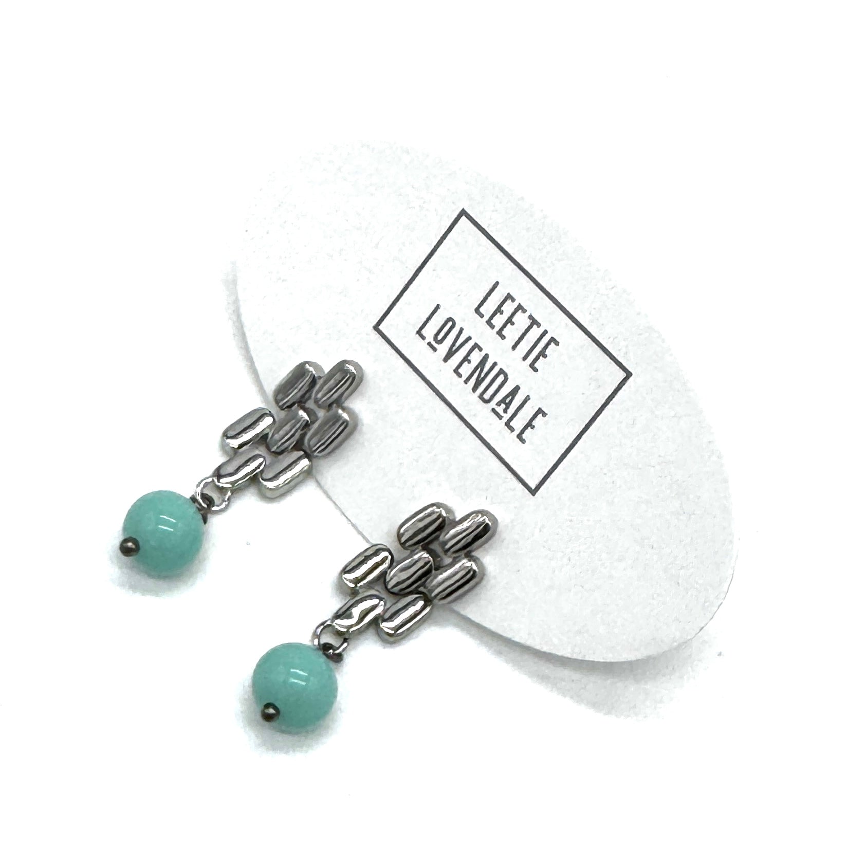 Silver drop earrings with a turquoise glass bead.
