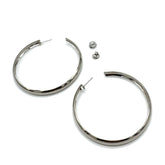 Large silver hoop earrings on a white background.