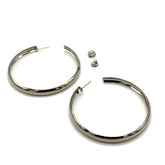 Large silver hoop earrings on a white background.