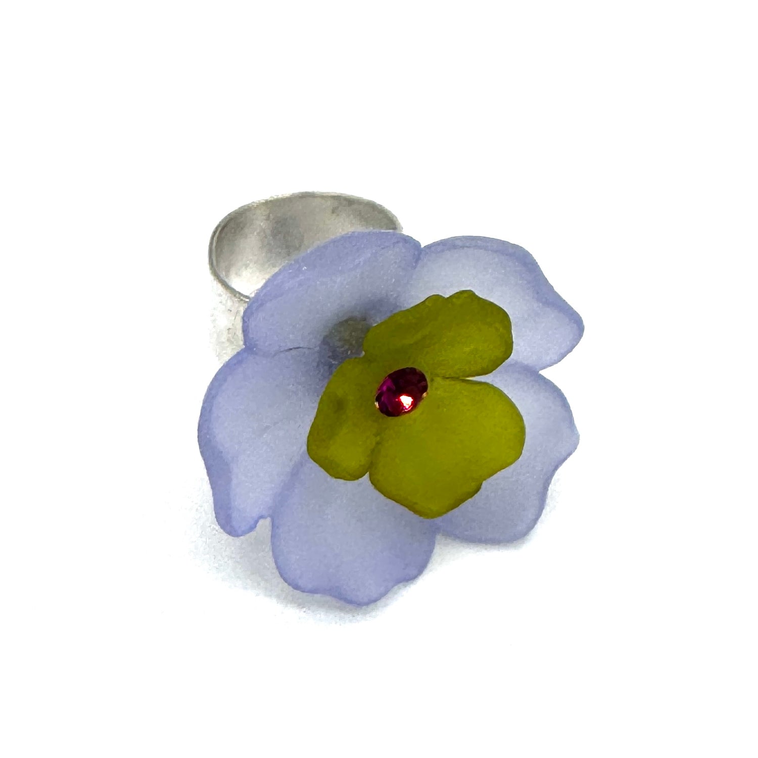 Periwinkle and olive green floral cocktail ring on a white background.