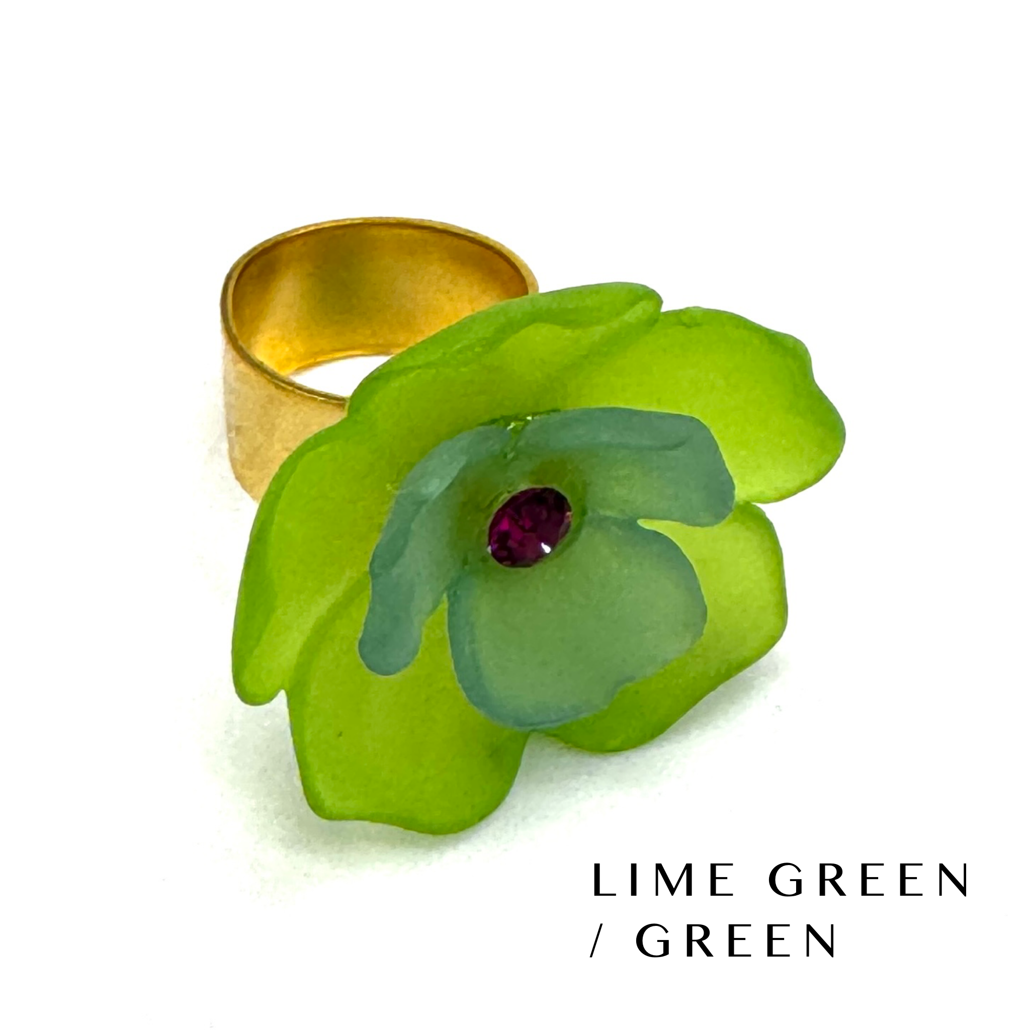 Floral cocktail ring on a white background labeled lime green/green.