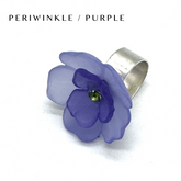Floral cocktail ring on a white background labeled periwinkle/purple.