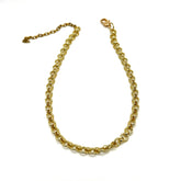 A gold-toned metal chain necklace with a lobster clasp and extender chain, displayed on a plain white background.