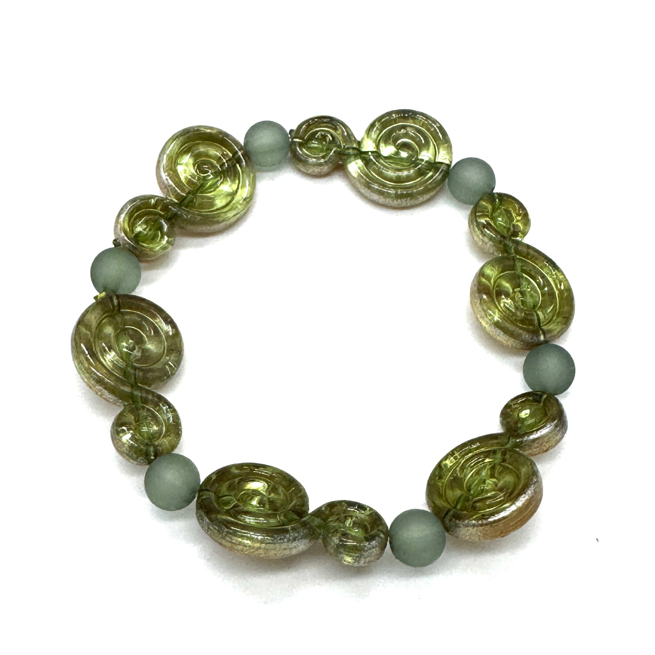 A beaded stretch bracelet featuring textured olive green spiral beads and matte sage green round beads, displayed on a clean white background.