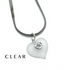 A silver snake chain necklace with a frosted clear heart-shaped pendant featuring a small silver heart in the center, shown on a white background with the word &
