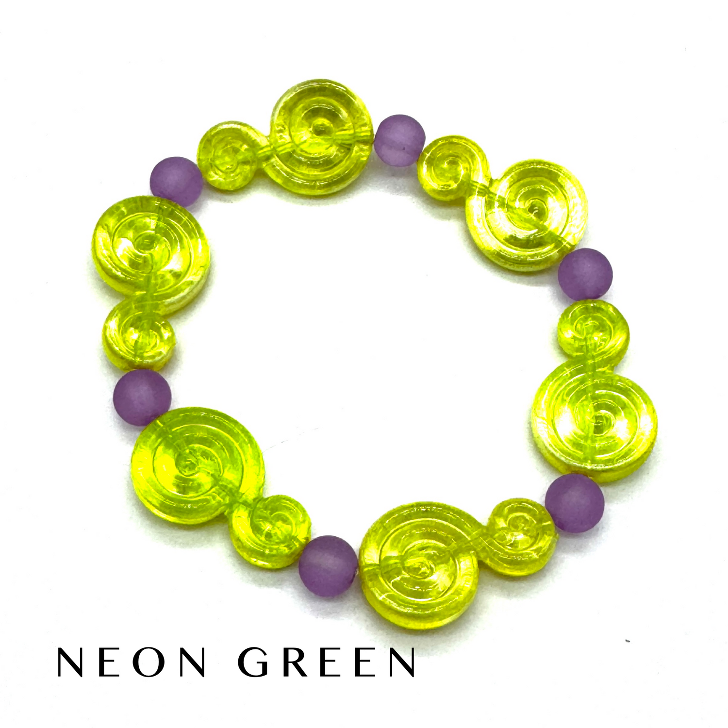 A beaded stretch bracelet featuring translucent neon green spiral-shaped beads and matte purple round beads, displayed on a white background with the text &