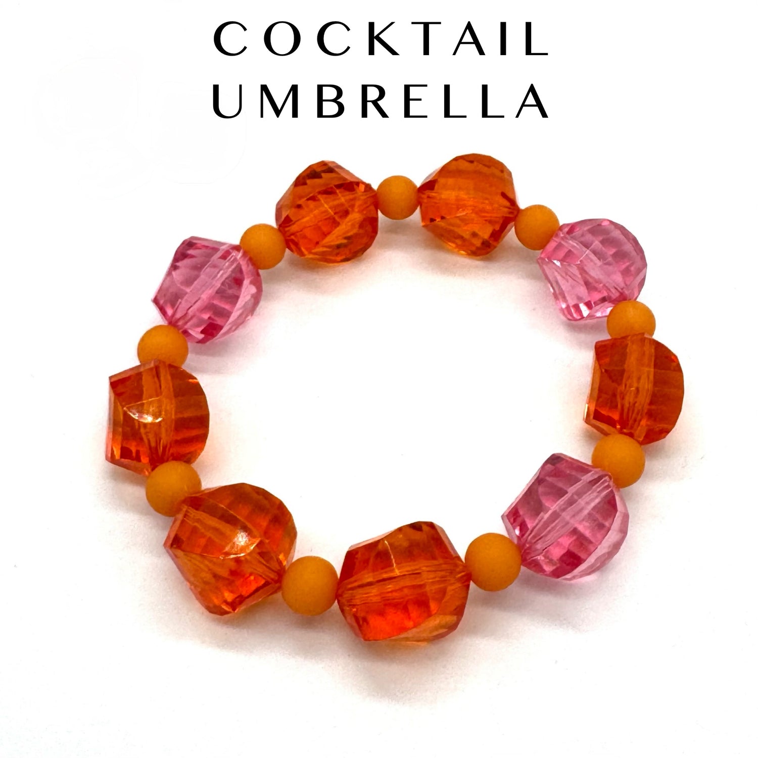 Colorful beaded bracelet with orange and pink beads on a white background.