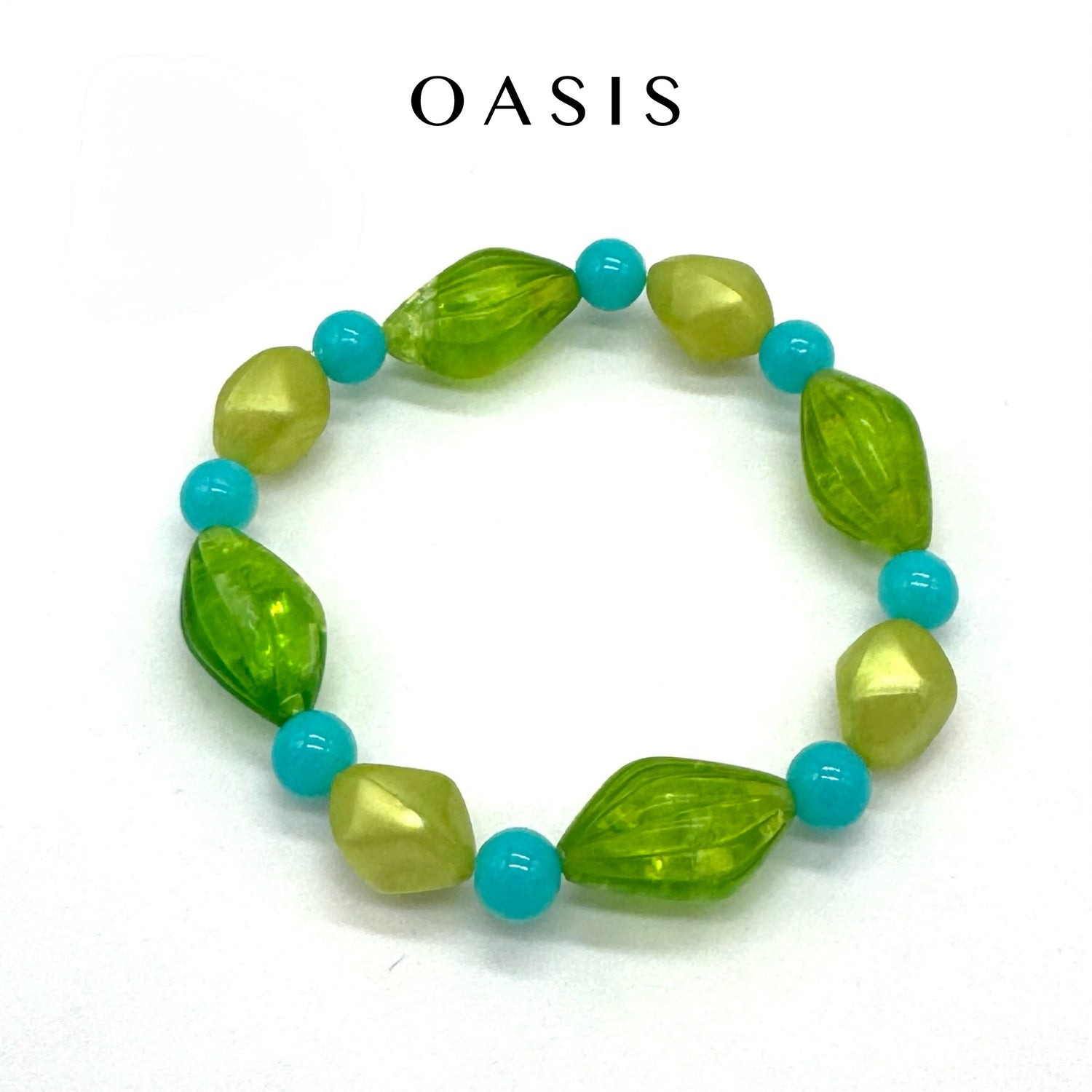 Green and turquoise beaded bracelet on a white background