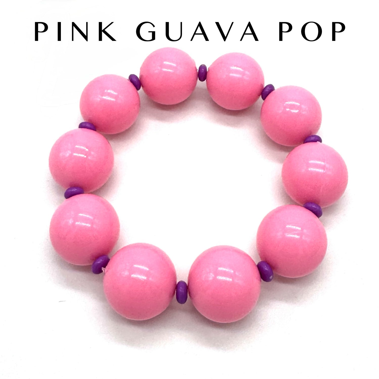 Pink beaded bracelet with purple accents on a white background, branded &