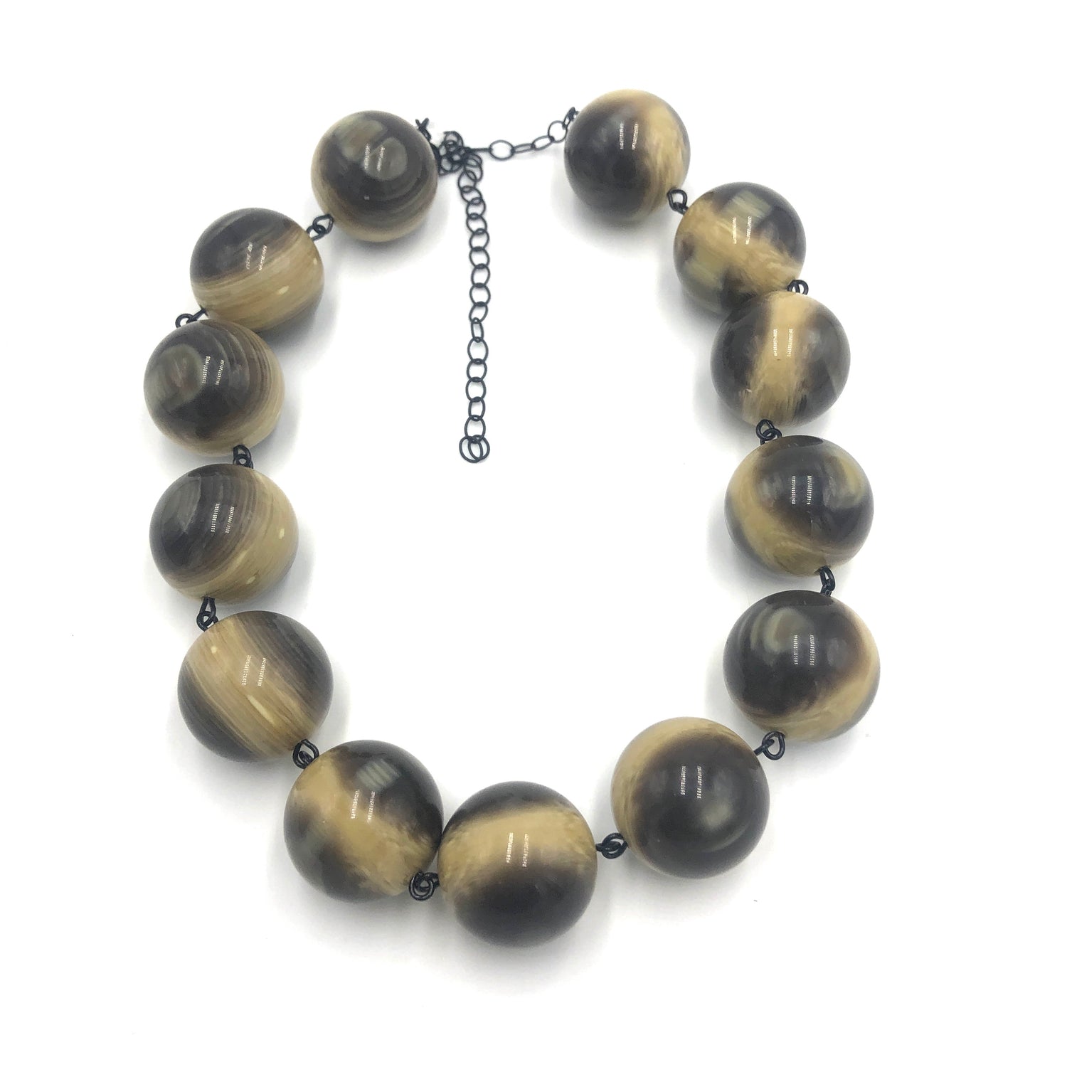 big brown beads on a necklace