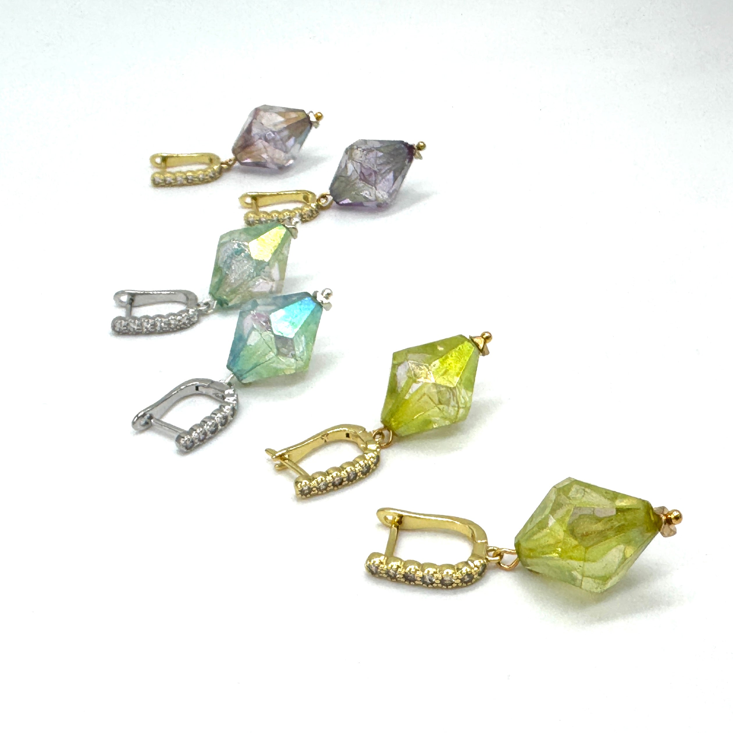 Colorful crystal earrings on a white background