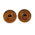 Pair of amber-colored circular earrings with intricate design on a white background