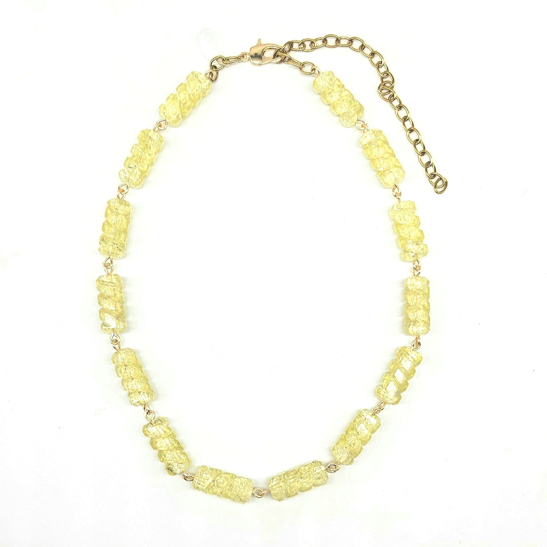 Necklace with yellow beads on a white background