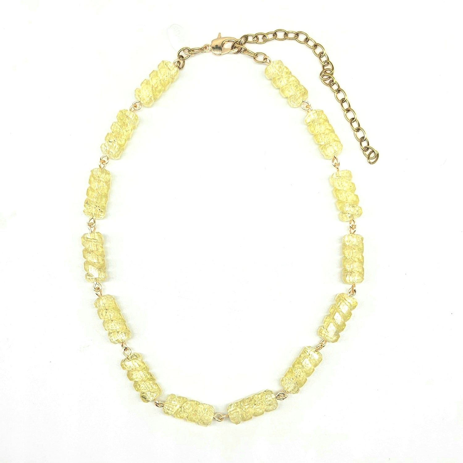 Necklace with yellow beads on a white background