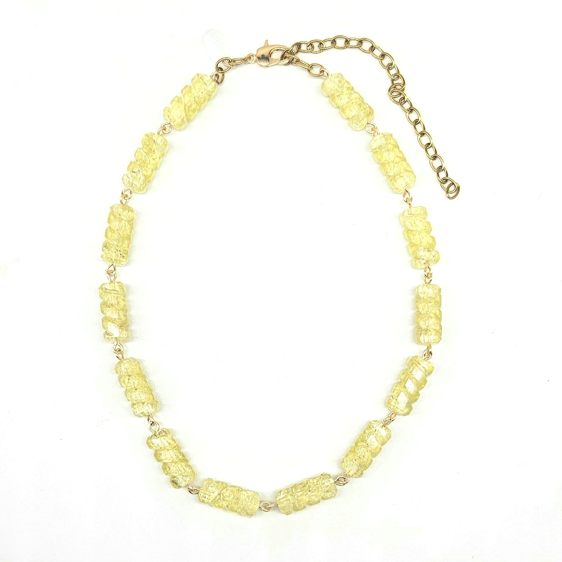 Necklace with yellow beads on a white background