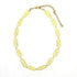 Necklace with yellow beads on a white background