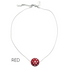 Necklace with a red and white polka dot pendant on a white background