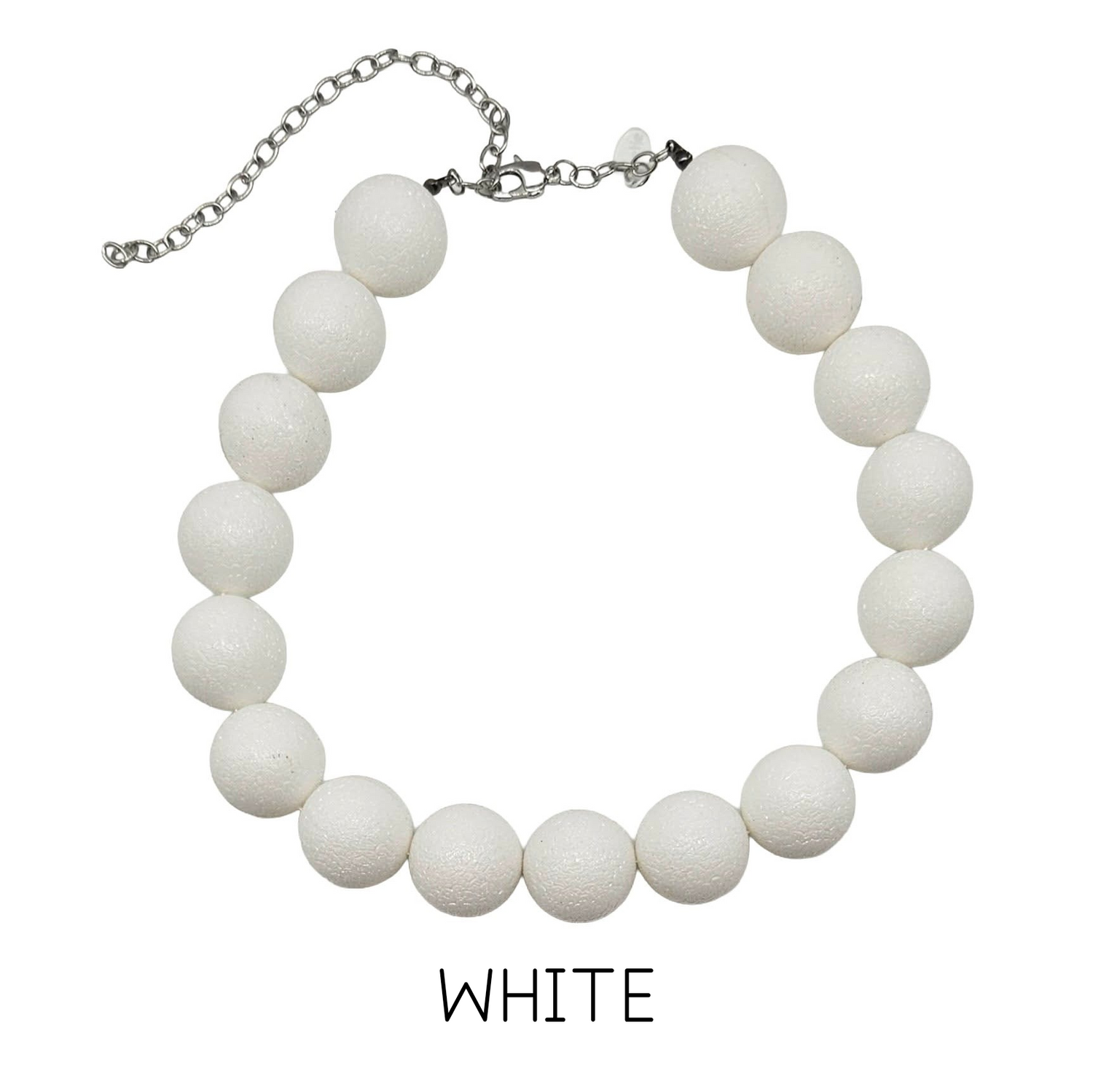 White beaded necklace on a white background with &