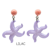 Pair of purple starfish-shaped earrings with pink tops on a white background