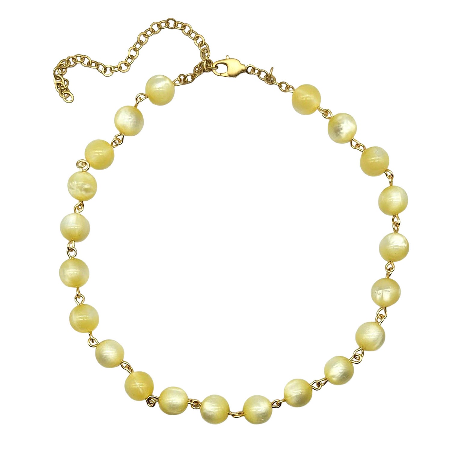 Cream colored moonglow beaded necklace with gold chain on a white background