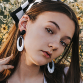 joanna earrings on model with checkerboard hat