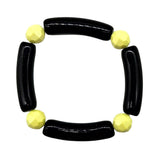 Black and yellow beaded bracelet on a white background