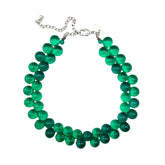 Transparent green beaded necklace on a white background.