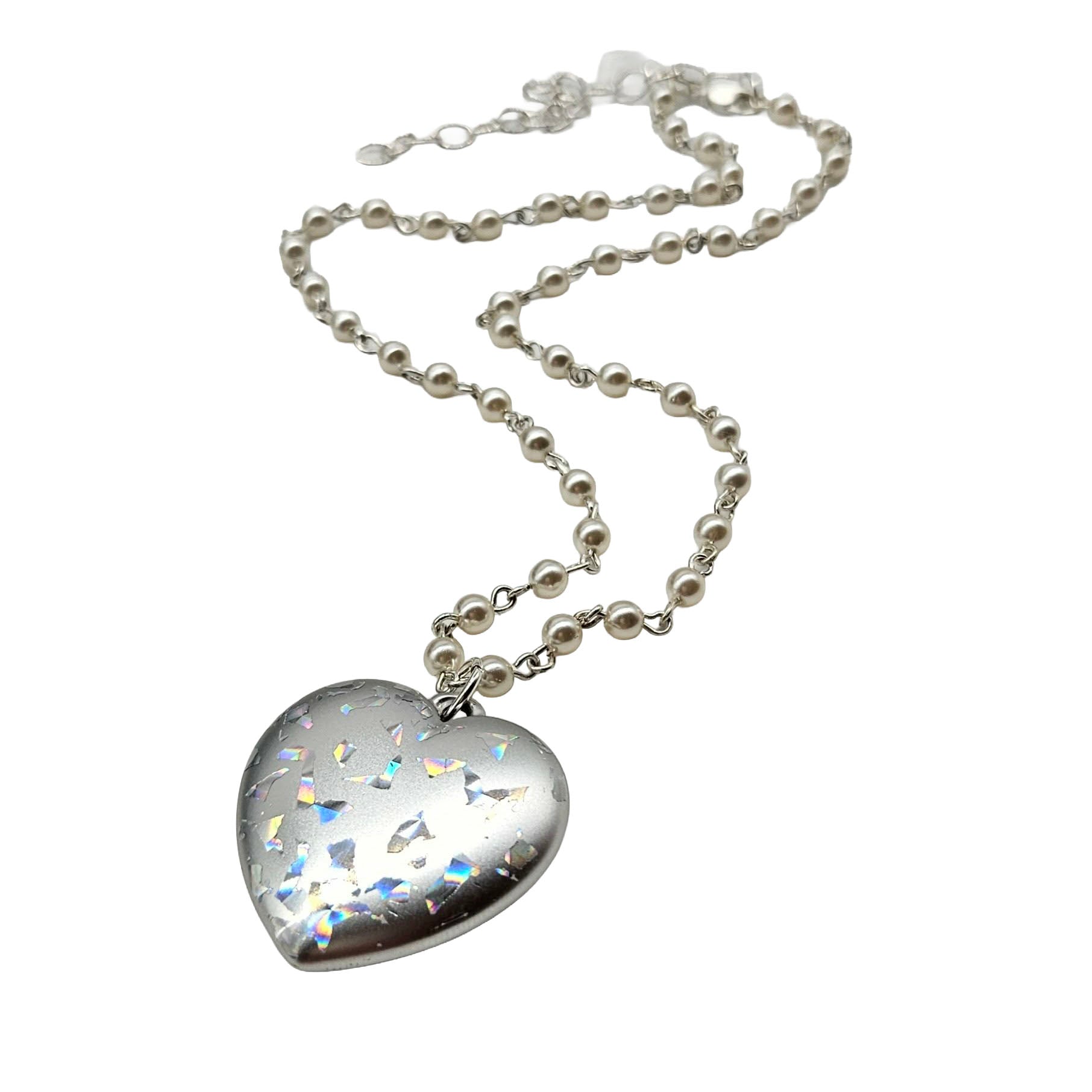 Heart-shaped silver pendant with a chain on a white background