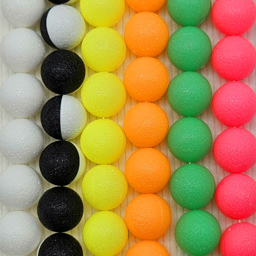 Colorful neon necklaces made with vintage lucite on a wooden background.