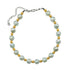 Pearlized lucite and golden moonglow lucite bead necklace on a white background