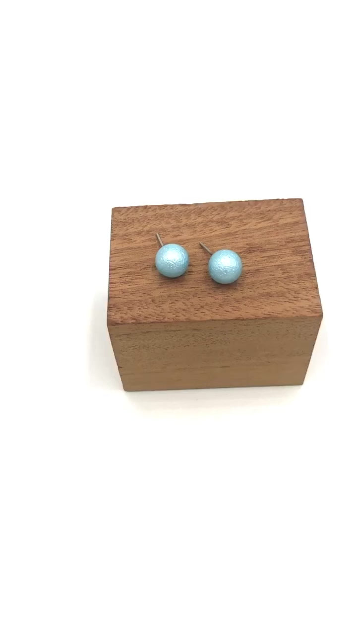 video of aqua pitted ball stud earrings