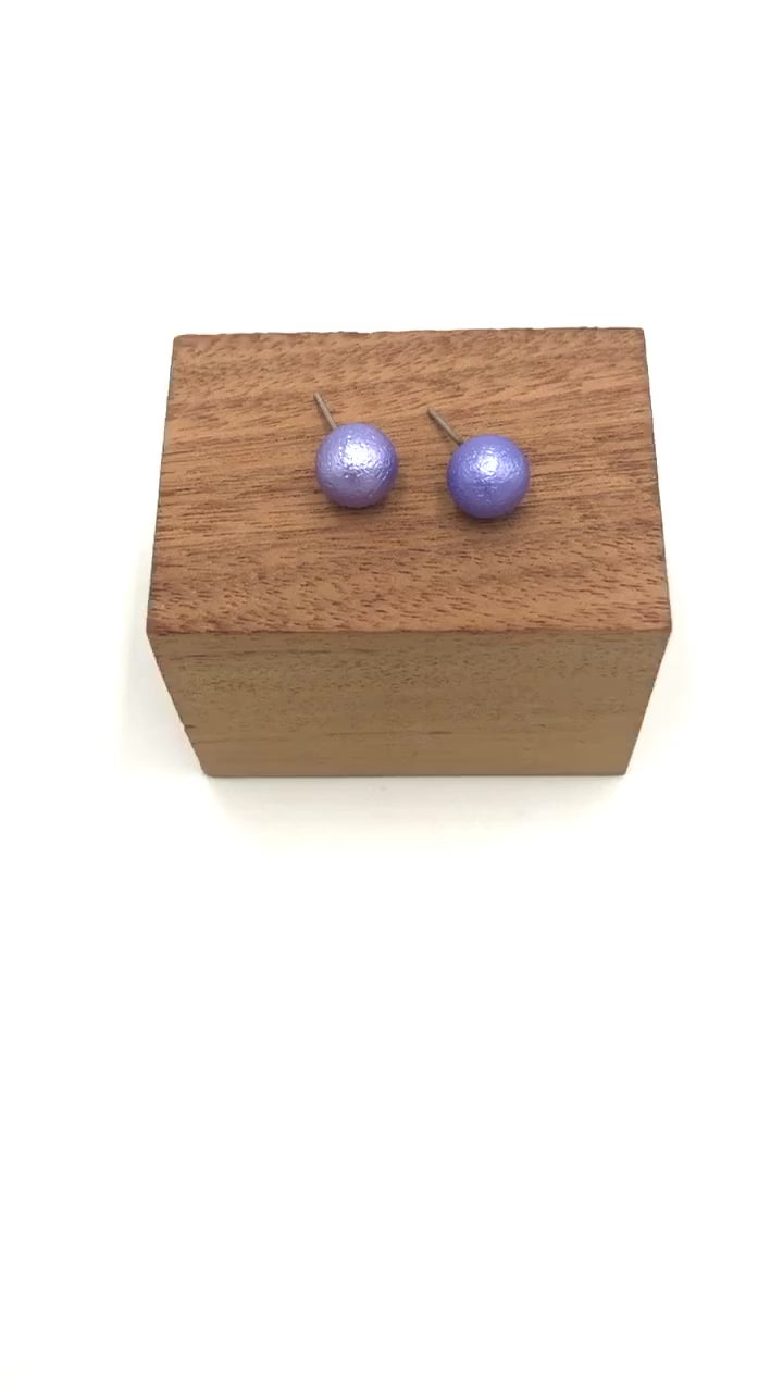 video of periwinkle pitted ball stud earrings