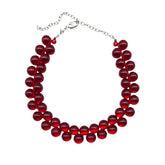 Red cluster beaded necklace on a white background.